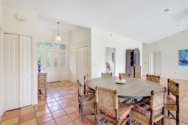 3388 Highlands Bridge Rd, Sarasota, FL 34235 - dining space with high vaulted ceiling and light tile patterned flooring