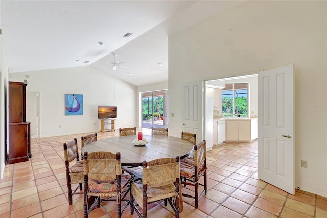 3388 Highlands Bridge Rd, Sarasota, FL 34235 - dining room featuring ceiling fan, light tile patterned floors, and high vaulted ceiling