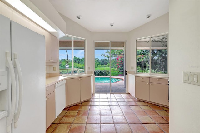 3388 Highlands Bridge Rd, Sarasota, FL 34235 - kitchen featuring white appliances, a sink, and light countertops