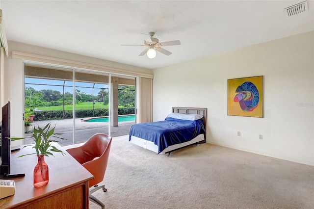 3388 Highlands Bridge Rd, Sarasota, FL 34235 - carpeted bedroom featuring access to exterior and a ceiling fan