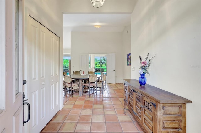 3388 Highlands Bridge Rd, Sarasota, FL 34235 - foyer with light tile patterned floors and a towering ceiling