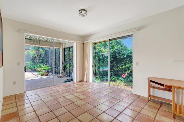 3388 Highlands Bridge Rd, Sarasota, FL 34235 - spare room featuring tile patterned flooring
