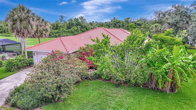 3388 Highlands Bridge Rd, Sarasota, FL 34235 - view of green lawn with a garage