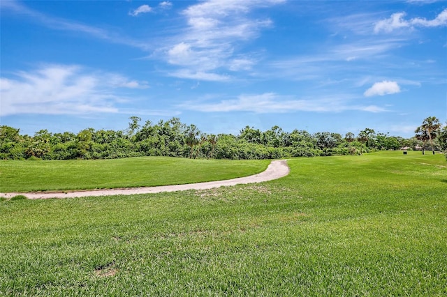 3388 Highlands Bridge Rd, Sarasota, FL 34235 - surrounding community with a lawn, view of scattered trees, and view of golf course