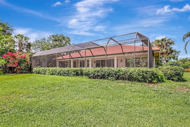 3388 Highlands Bridge Rd, Sarasota, FL 34235 - rear view of house with a lawn and a lanai