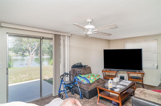 3921 Marlborough Pl, Sarasota, FL 34241 - living room with a ceiling fan, carpet flooring, and a textured ceiling