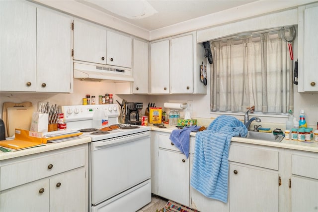 3921 Marlborough Pl, Sarasota, FL 34241 - kitchen featuring under cabinet range hood, white range with electric cooktop, light countertops, and a sink