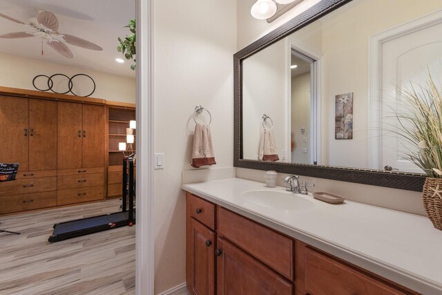 801 3rd St E, Palmetto, FL 34221 - bathroom featuring vanity, ceiling fan, and wood finished floors