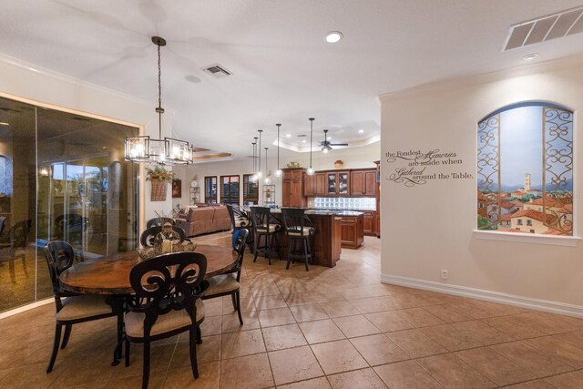 801 3rd St E, Palmetto, FL 34221 - dining room with ornamental molding, light tile patterned floors, a chandelier, baseboards, and recessed lighting
