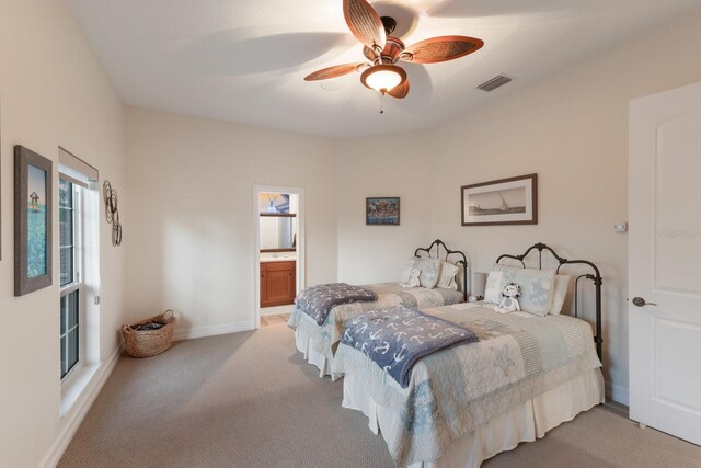 801 3rd St E, Palmetto, FL 34221 - bedroom with light colored carpet, a ceiling fan, and baseboards