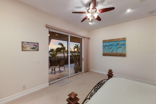 801 3rd St E, Palmetto, FL 34221 - bedroom featuring access to outside, carpet flooring, baseboards, and ceiling fan