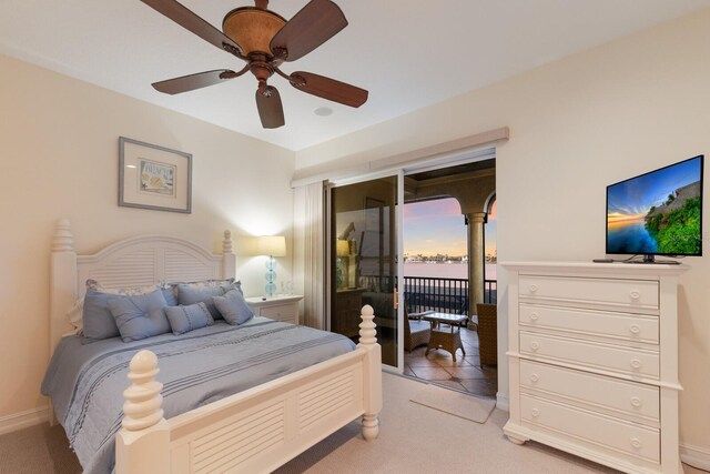 801 3rd St E, Palmetto, FL 34221 - bedroom featuring access to outside, light colored carpet, ceiling fan, and baseboards