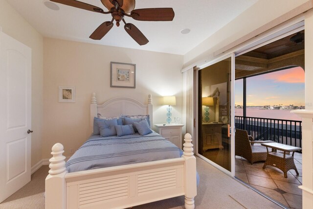 801 3rd St E, Palmetto, FL 34221 - bedroom with access to outside, carpet floors, and ceiling fan