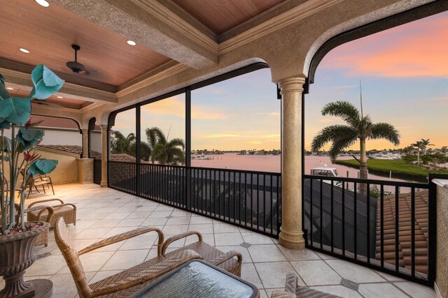 801 3rd St E, Palmetto, FL 34221 - patio terrace at dusk with a water view and a balcony