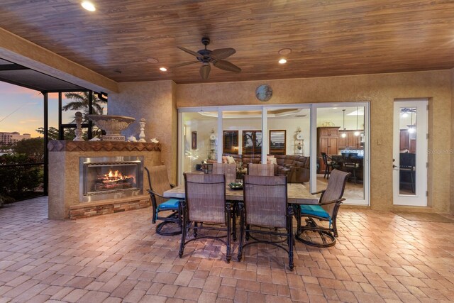 801 3rd St E, Palmetto, FL 34221 - view of patio with an outdoor stone fireplace and ceiling fan