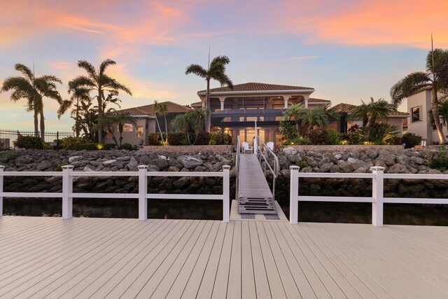 801 3rd St E, Palmetto, FL 34221 - dock area featuring a balcony and a wooden deck