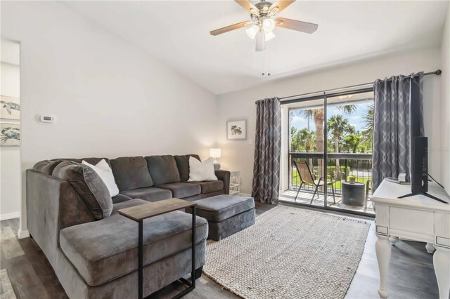 4061 Crockers Lake Blvd Unit 27, Sarasota, FL 34238 - living area featuring a ceiling fan, wood finished floors, lofted ceiling, and baseboards