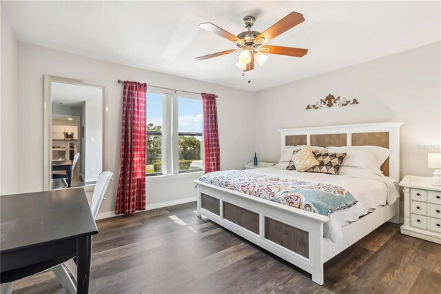 4061 Crockers Lake Blvd Unit 27, Sarasota, FL 34238 - bedroom with wood finished floors, baseboards, and a ceiling fan