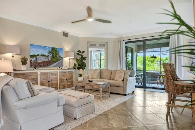 5843 Wake Forest Run Unit 104, Bradenton, FL 34211 - tiled living room with a ceiling fan and crown molding