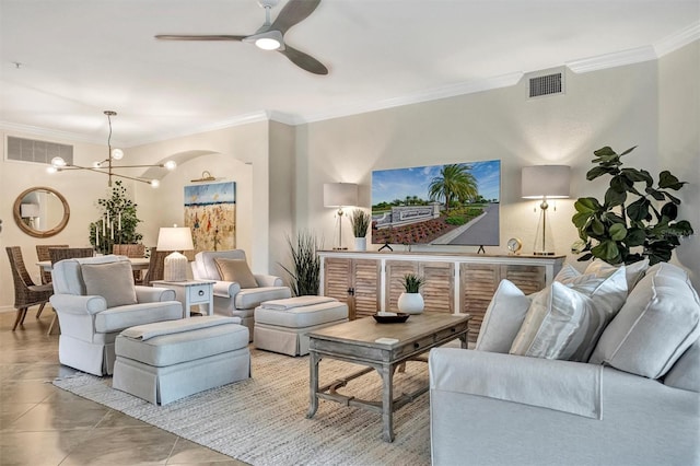 5843 Wake Forest Run Unit 104, Bradenton, FL 34211 - living room with crown molding, a chandelier, a ceiling fan, tile patterned flooring, and baseboards