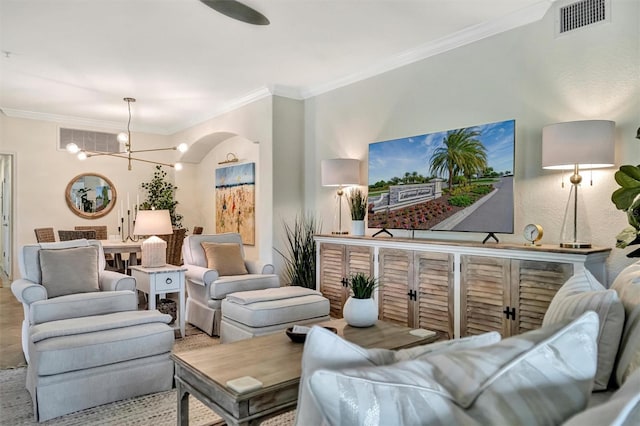 5843 Wake Forest Run Unit 104, Bradenton, FL 34211 - living area featuring ornamental molding, a chandelier, and arched walkways