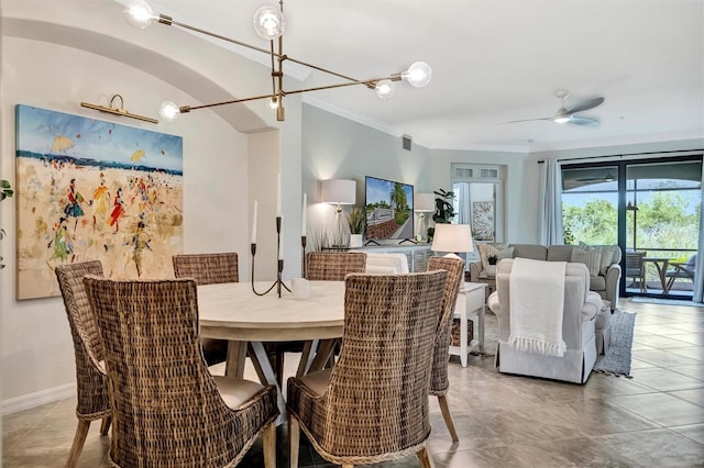 5843 Wake Forest Run Unit 104, Bradenton, FL 34211 - dining space with crown molding, tile patterned flooring, a ceiling fan, and a chandelier