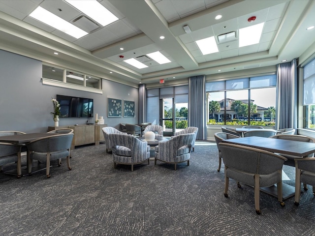 5843 Wake Forest Run Unit 104, Bradenton, FL 34211 - living area featuring carpet flooring and a towering ceiling