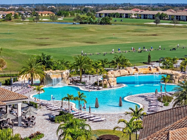 5843 Wake Forest Run Unit 104, Bradenton, FL 34211 - community pool featuring view of golf course and a yard