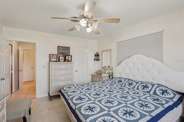 1190 Jamaica Rd, Venice, FL 34293 - bedroom featuring a ceiling fan, light carpet, a closet, and light tile patterned floors