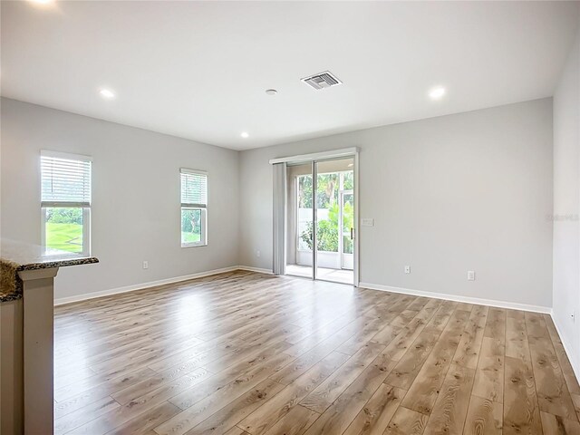 1053 Grantham Dr, Sarasota, FL 34234 - spare room with light wood finished floors, baseboards, and recessed lighting