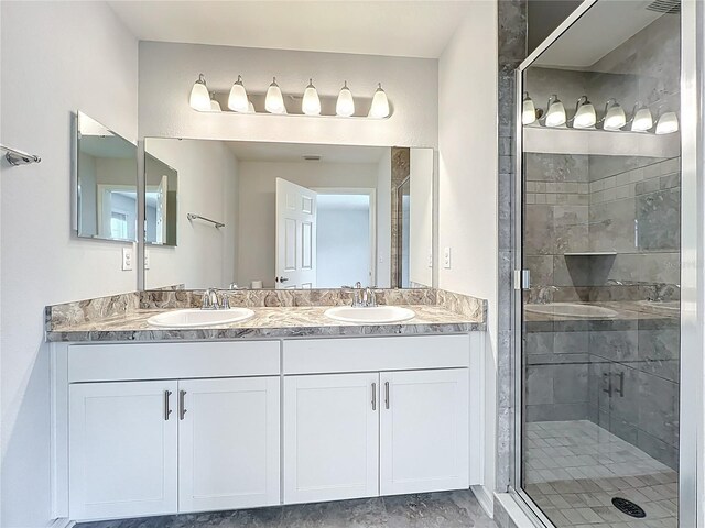 1053 Grantham Dr, Sarasota, FL 34234 - bathroom with double vanity and a shower stall