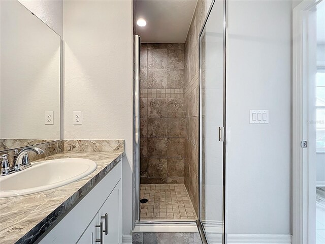 1053 Grantham Dr, Sarasota, FL 34234 - full bathroom with vanity and a shower stall
