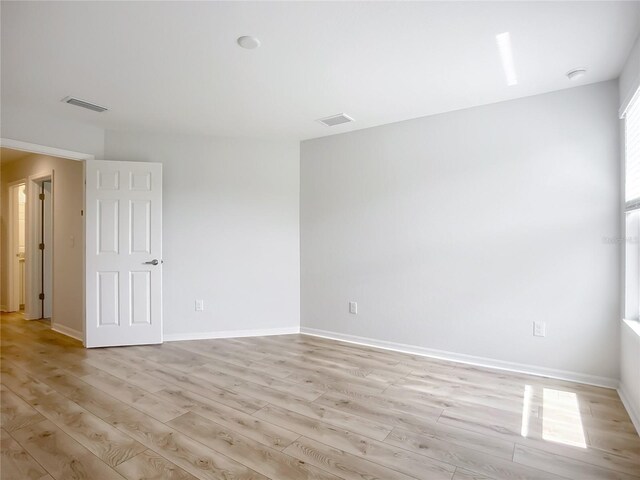 1053 Grantham Dr, Sarasota, FL 34234 - spare room featuring light wood-type flooring and baseboards