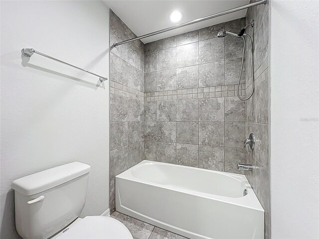 1053 Grantham Dr, Sarasota, FL 34234 - full bathroom with toilet,  shower combination, and tile patterned flooring