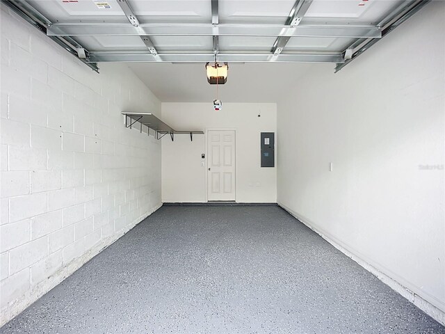 1053 Grantham Dr, Sarasota, FL 34234 - garage with a garage door opener, electric panel, and concrete block wall