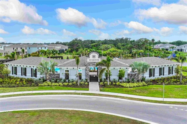 5046 Rocky Coast Pl, Palmetto, FL 34221 - view of front facade with a residential view and a front yard
