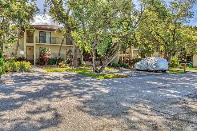 6501 Mourning Dove Dr Unit 215, Bradenton, FL 34210 - townhome / multi-family property with stucco siding, a tiled roof, and stairway