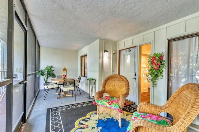 6501 Mourning Dove Dr Unit 215, Bradenton, FL 34210 - sunroom featuring carpet floors and a textured ceiling