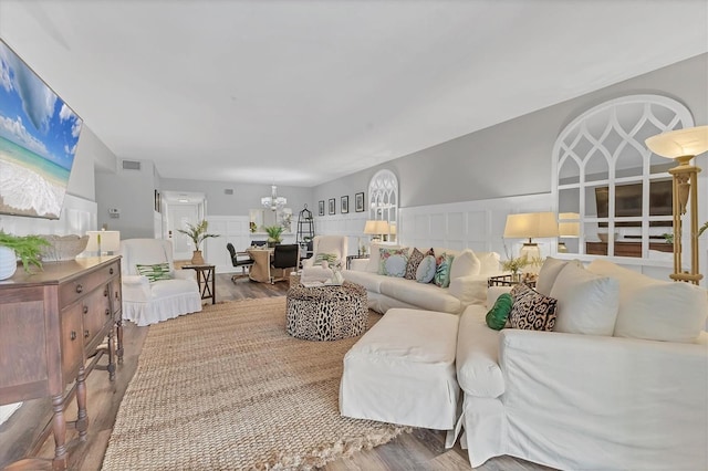 6501 Mourning Dove Dr Unit 215, Bradenton, FL 34210 - living area featuring a chandelier and wood finished floors
