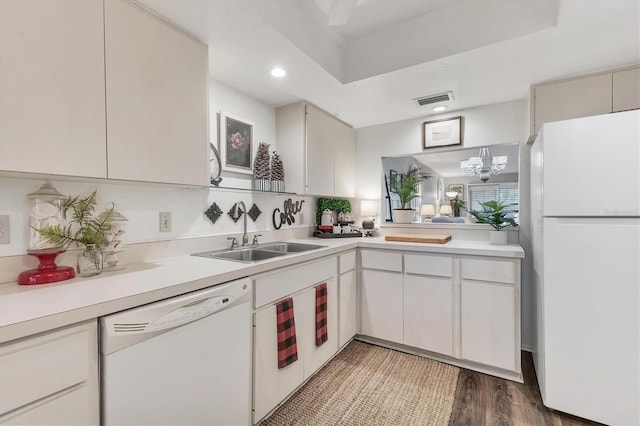 6501 Mourning Dove Dr Unit 215, Bradenton, FL 34210 - kitchen featuring white appliances, a sink, light countertops, recessed lighting, and light wood finished floors