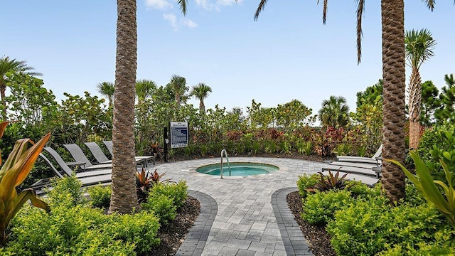 15752 Sacile Ln, Bradenton, FL 34211 - view of swimming pool with a hot tub and a patio