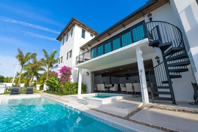 340 Jackson Dr, Sarasota, FL 34236 - back of property with stairs, an in-ground hot tub, an outdoor pool, and a patio