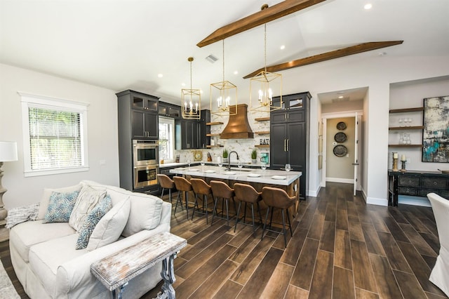340 Jackson Dr, Sarasota, FL 34236 - kitchen featuring open shelves, light countertops, double oven, a kitchen breakfast bar, and tasteful backsplash