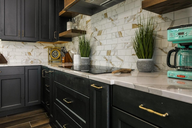 340 Jackson Dr, Sarasota, FL 34236 - kitchen featuring open shelves, tasteful backsplash, black electric cooktop, light stone counters, and custom exhaust hood