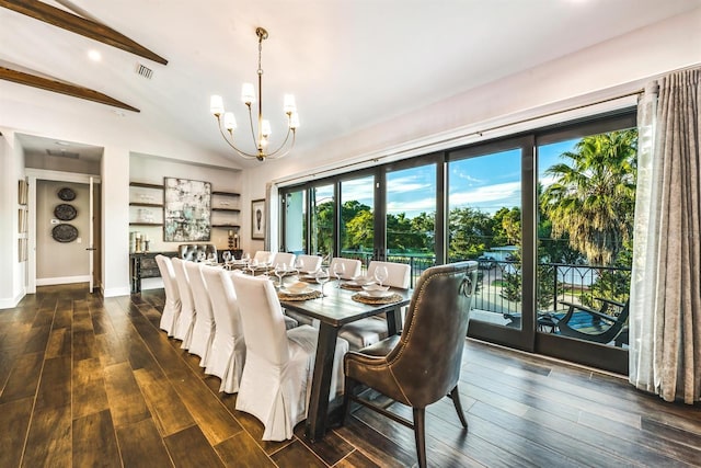 340 Jackson Dr, Sarasota, FL 34236 - dining space with a chandelier, dark wood finished floors, and baseboards