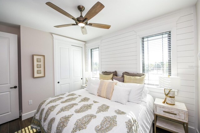 340 Jackson Dr, Sarasota, FL 34236 - bedroom featuring dark wood-type flooring, a closet, ceiling fan, and baseboards