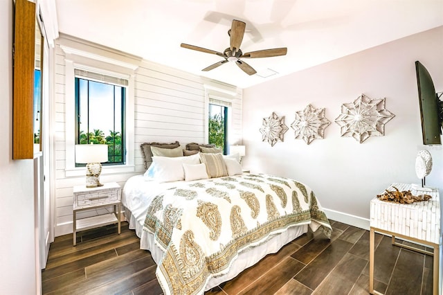340 Jackson Dr, Sarasota, FL 34236 - bedroom with dark wood finished floors, baseboards, and a ceiling fan