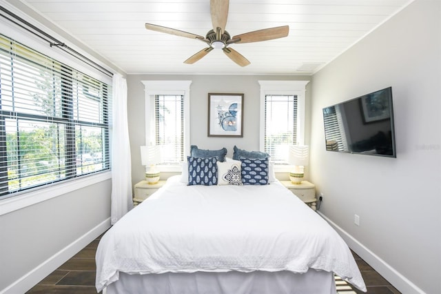 340 Jackson Dr, Sarasota, FL 34236 - bedroom featuring multiple windows, baseboards, ceiling fan, dark wood finished floors, and wooden ceiling