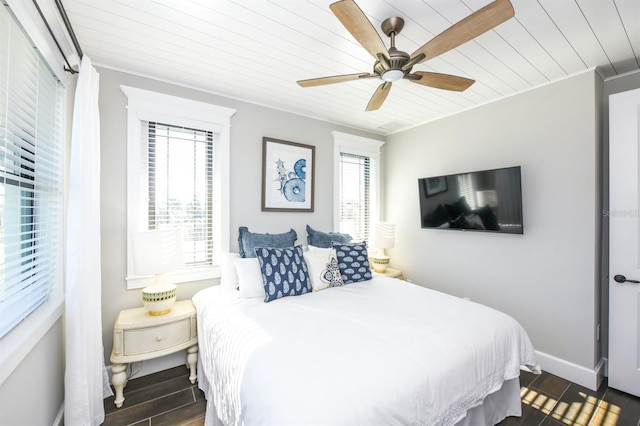 340 Jackson Dr, Sarasota, FL 34236 - bedroom featuring wooden ceiling, dark wood-style flooring, a ceiling fan, crown molding, and baseboards