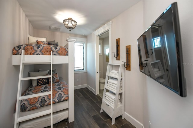 340 Jackson Dr, Sarasota, FL 34236 - bedroom featuring baseboards and wood finish floors